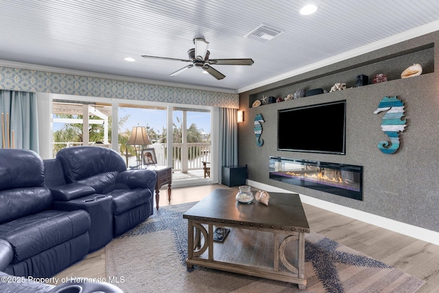 4523 Gulfstream Dr, Hernando Beach, FL 34607 - living room featuring crown molding, a ceiling fan, wood finished floors, wallpapered walls, and recessed lighting