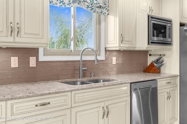 4523 Gulfstream Dr, Hernando Beach, FL 34607 - kitchen with appliances with stainless steel finishes, a sink, and decorative backsplash
