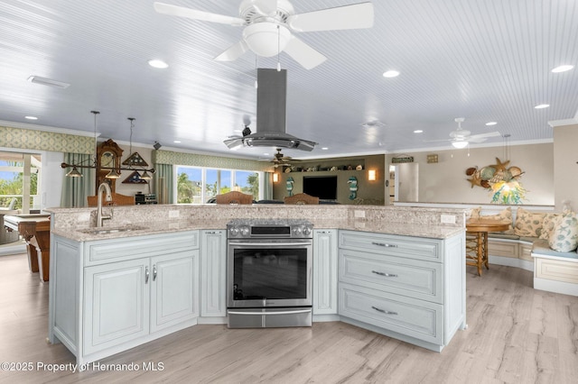 4523 Gulfstream Dr, Hernando Beach, FL 34607 - kitchen with stainless steel electric range, a sink, ceiling fan, crown molding, and healthy amount of natural light