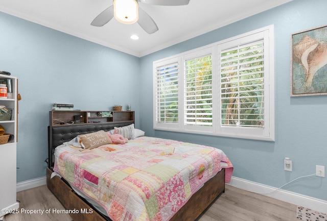 4523 Gulfstream Dr, Hernando Beach, FL 34607 - bedroom with wood finished floors, crown molding, baseboards, and ceiling fan