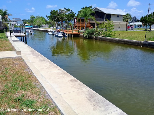 4983 Cedarbrook Ln, Hernando Beach, FL 34607 - dock featuring a water view and a yard