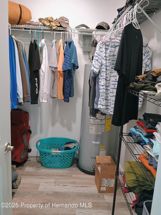 4983 Cedarbrook Ln, Hernando Beach, FL 34607 - walk in closet featuring wood finished floors
