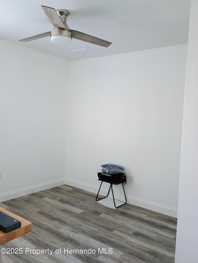 4983 Cedarbrook Ln, Hernando Beach, FL 34607 - unfurnished room with a ceiling fan, wood finished floors, and baseboards