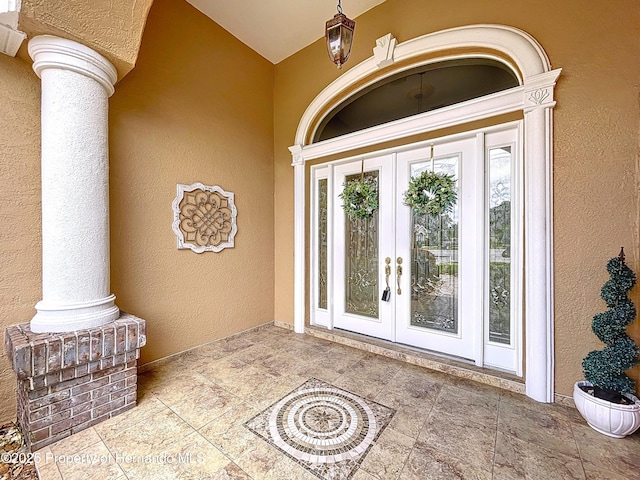 13417 Whitehaven Ct, Spring Hill, FL 34609 - doorway to property with french doors and stucco siding