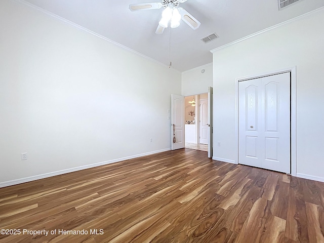 13417 Whitehaven Ct, Spring Hill, FL 34609 - unfurnished bedroom with ornamental molding, wood finished floors, baseboards, and a ceiling fan