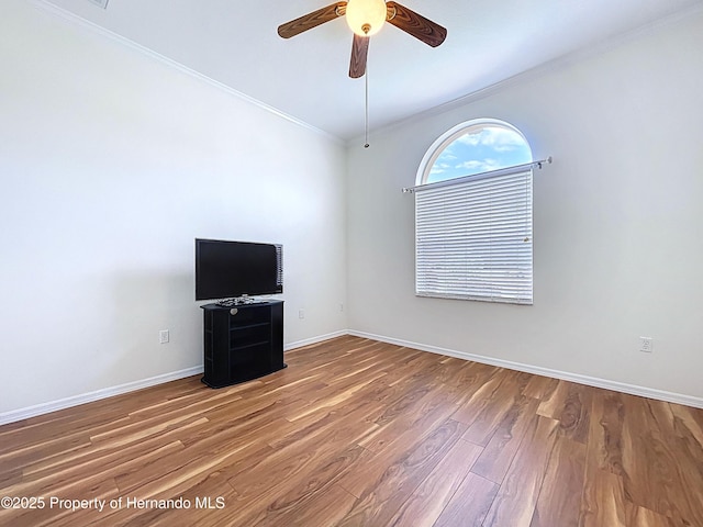 13417 Whitehaven Ct, Spring Hill, FL 34609 - empty room with crown molding, ceiling fan, wood finished floors, and baseboards