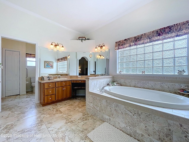 13417 Whitehaven Ct, Spring Hill, FL 34609 - bathroom featuring plenty of natural light, a bath, ornamental molding, vanity, and toilet