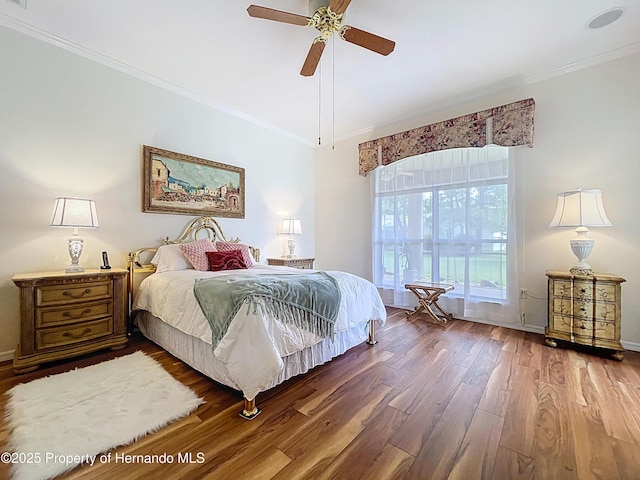 13417 Whitehaven Ct, Spring Hill, FL 34609 - bedroom featuring wood finished floors, ornamental molding, baseboards, and ceiling fan