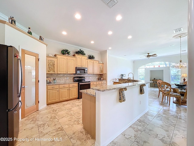 13417 Whitehaven Ct, Spring Hill, FL 34609 - kitchen featuring stainless steel appliances, ornamental molding, a ceiling fan, light marble finish flooring, and light brown cabinetry