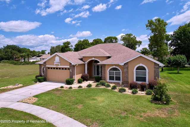 13417 Whitehaven Ct, Spring Hill, FL 34609 - view of front of house with an attached garage, a front lawn, concrete driveway, and stucco siding