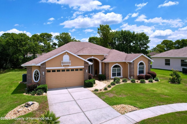 13417 Whitehaven Ct, Spring Hill, FL 34609 - ranch-style house featuring an attached garage, a front lawn, concrete driveway, and stucco siding