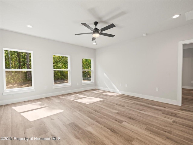 14448 Chimney Swift Rd, Weeki Wachee, FL 34614 - unfurnished room with baseboards, wood finished floors, ceiling fan, and recessed lighting