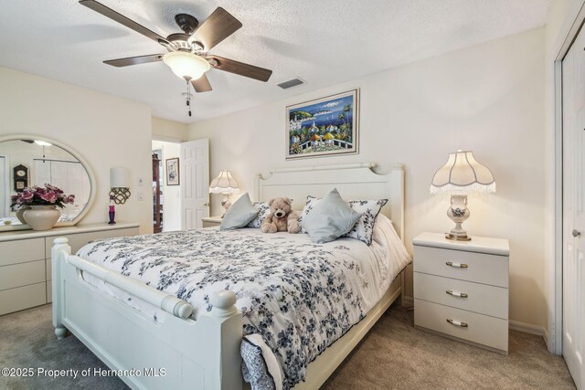 18223 Nestlebranch Ct, Hudson, FL 34667 - bedroom with light colored carpet and ceiling fan