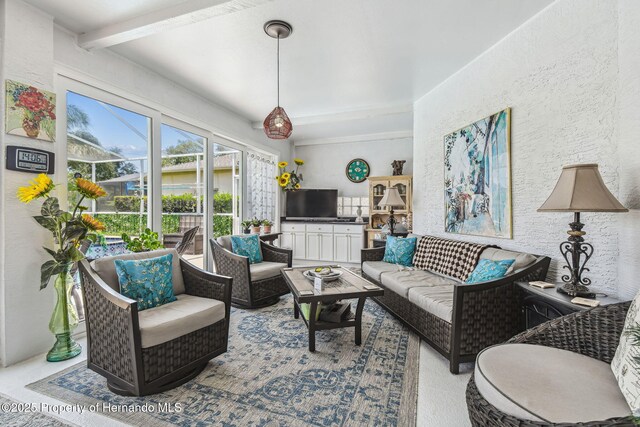 18223 Nestlebranch Ct, Hudson, FL 34667 - living area featuring beamed ceiling and a textured wall