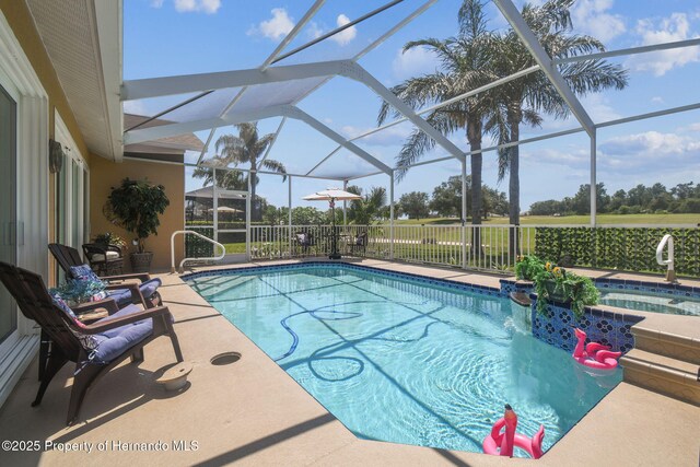18223 Nestlebranch Ct, Hudson, FL 34667 - view of pool with an outdoor hot tub, a patio area, and glass enclosure