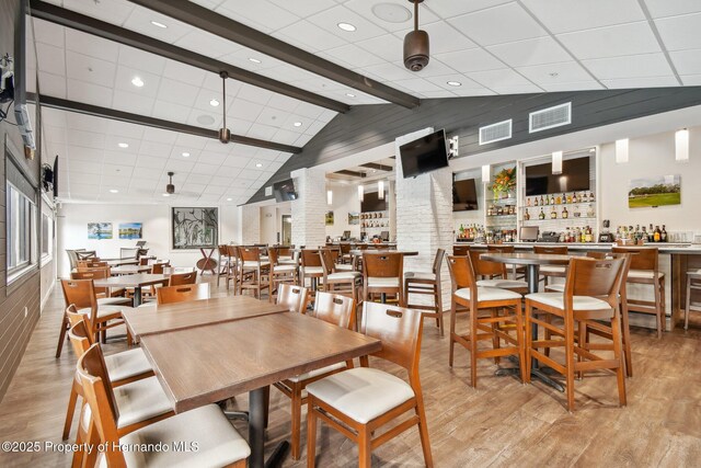 18223 Nestlebranch Ct, Hudson, FL 34667 - dining area with light wood-style floors and recessed lighting