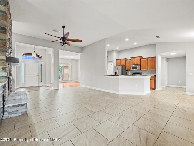 12167 Bath St, Spring Hill, FL 34609 - unfurnished living room featuring a ceiling fan, lofted ceiling, recessed lighting, baseboards, and a sink