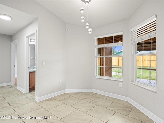 12167 Bath St, Spring Hill, FL 34609 - unfurnished dining area featuring light tile patterned flooring and baseboards