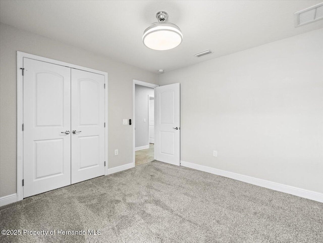 12167 Bath St, Spring Hill, FL 34609 - unfurnished bedroom featuring carpet, baseboards, and a closet