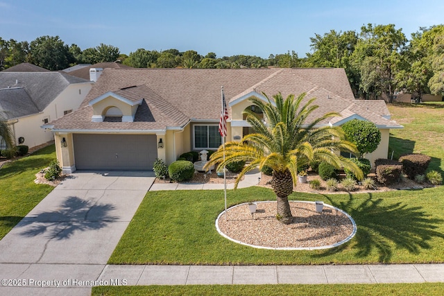 1049 Larkin Rd, Spring Hill, FL 34608 - view of front of home with stucco siding, an attached garage, driveway, and a front yard