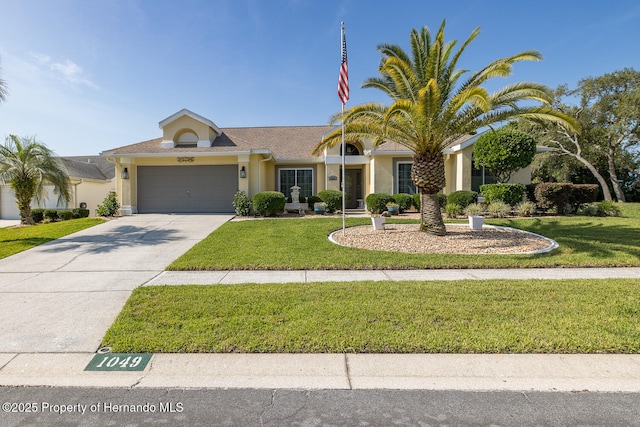 1049 Larkin Rd, Spring Hill, FL 34608 - ranch-style house with an attached garage, stucco siding, a front lawn, and driveway