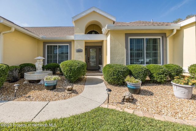 1049 Larkin Rd, Spring Hill, FL 34608 - property entrance with stucco siding