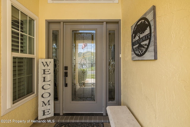 1049 Larkin Rd, Spring Hill, FL 34608 - doorway to property featuring stucco siding