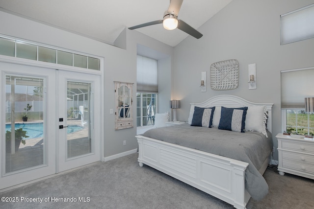 1049 Larkin Rd, Spring Hill, FL 34608 - carpeted bedroom featuring access to exterior, high vaulted ceiling, baseboards, and a ceiling fan