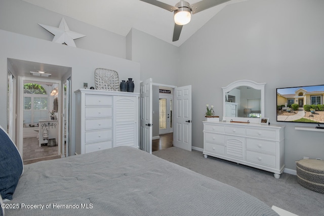 1049 Larkin Rd, Spring Hill, FL 34608 - bedroom featuring high vaulted ceiling, light colored carpet, baseboards, and a ceiling fan
