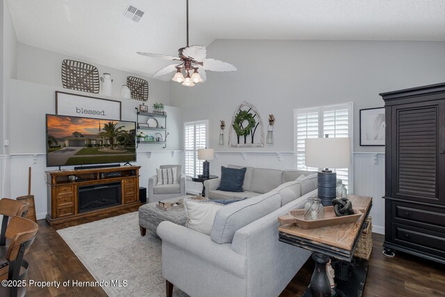 1049 Larkin Rd, Spring Hill, FL 34608 - living room with ceiling fan, wood finished floors, and high vaulted ceiling