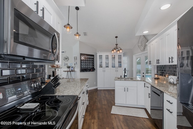 1049 Larkin Rd, Spring Hill, FL 34608 - kitchen with stainless steel microwave, electric range oven, dishwasher, a sink, and a peninsula