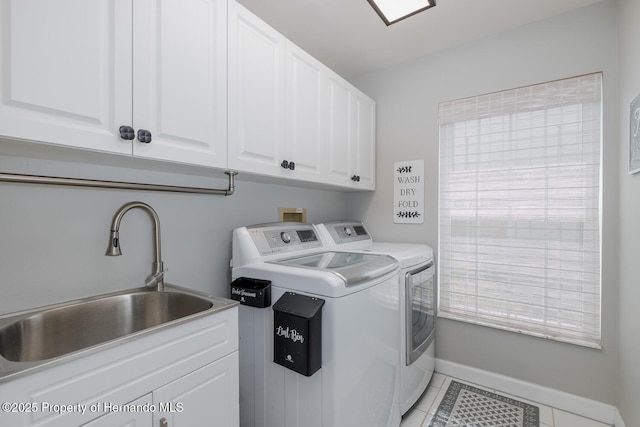 1049 Larkin Rd, Spring Hill, FL 34608 - laundry area with washer and dryer, cabinet space, light tile patterned floors, and baseboards