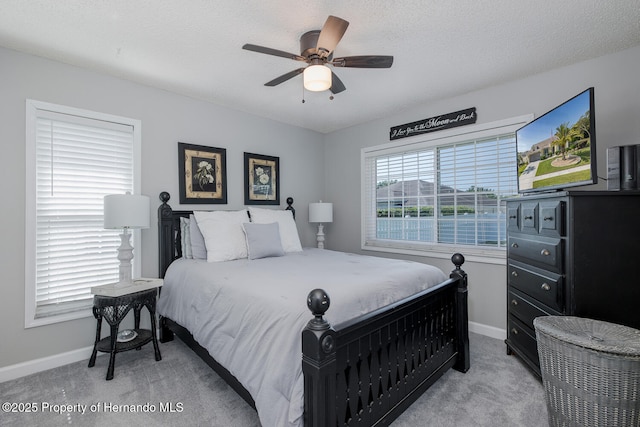 1049 Larkin Rd, Spring Hill, FL 34608 - bedroom featuring light colored carpet, baseboards, and ceiling fan