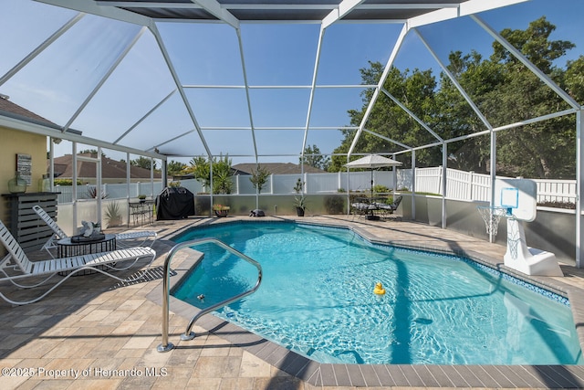 1049 Larkin Rd, Spring Hill, FL 34608 - view of swimming pool featuring a fenced backyard, a patio, and glass enclosure