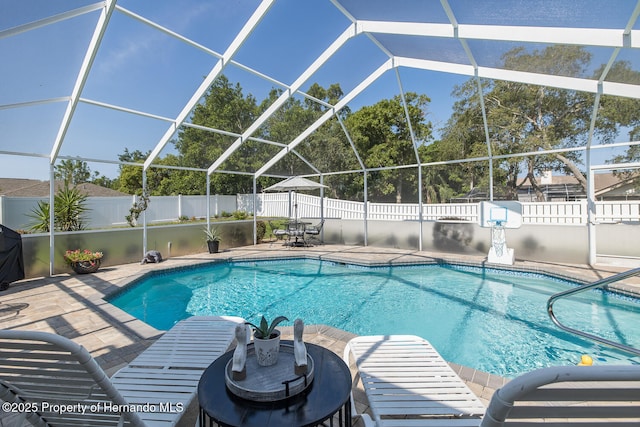 1049 Larkin Rd, Spring Hill, FL 34608 - view of pool with a patio, a fenced backyard, glass enclosure, and outdoor dining area
