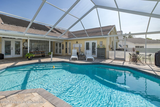 1049 Larkin Rd, Spring Hill, FL 34608 - swimming pool with french doors, a patio, and glass enclosure