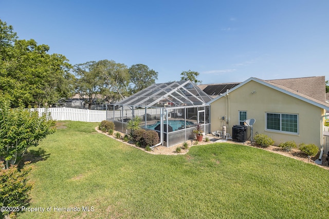 1049 Larkin Rd, Spring Hill, FL 34608 - back of property featuring stucco siding, glass enclosure, and a patio