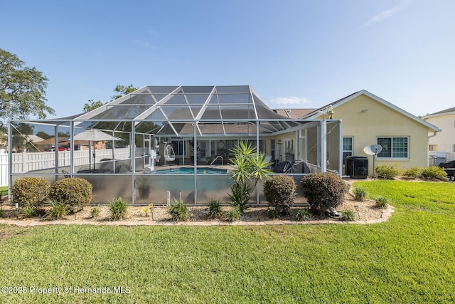 1049 Larkin Rd, Spring Hill, FL 34608 - rear view of property featuring stucco siding, a lanai, and cooling unit