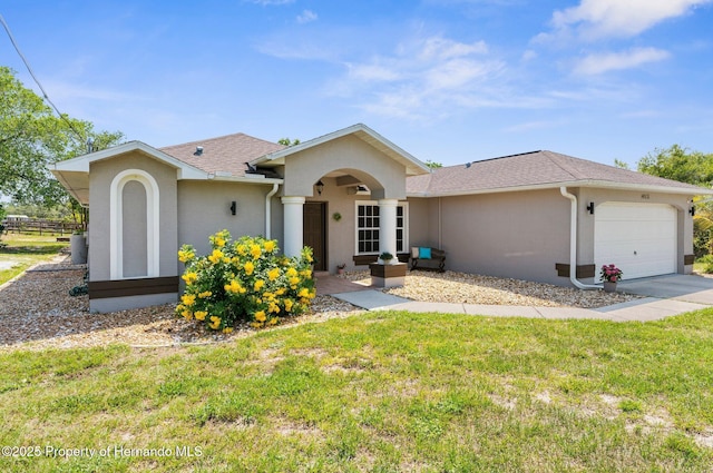 14031 Hexam Rd, Brooksville, FL 34613 - ranch-style house featuring an attached garage, a front yard, stucco siding, and roof with shingles