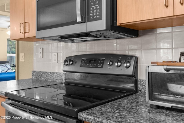 14031 Hexam Rd, Brooksville, FL 34613 - kitchen with stainless steel appliances and backsplash