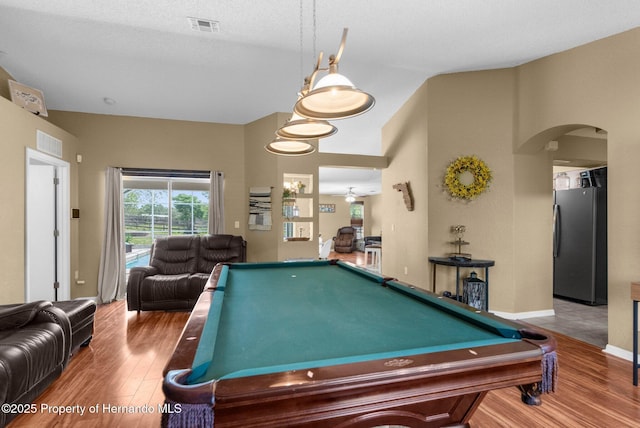 14031 Hexam Rd, Brooksville, FL 34613 - game room with arched walkways, wood finished floors, and billiards