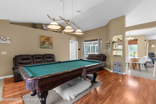 14031 Hexam Rd, Brooksville, FL 34613 - recreation room with billiards, baseboards, plenty of natural light, wood finished floors, and high vaulted ceiling