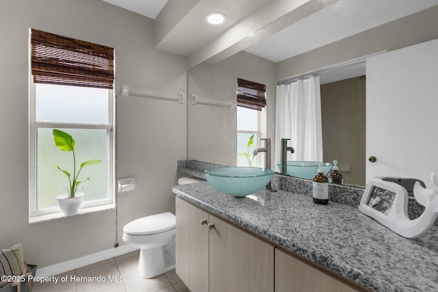14031 Hexam Rd, Brooksville, FL 34613 - bathroom with toilet, vanity, tile patterned flooring, baseboards, and curtained shower