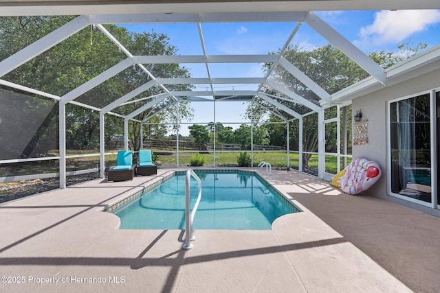 14031 Hexam Rd, Brooksville, FL 34613 - outdoor pool with a patio and glass enclosure