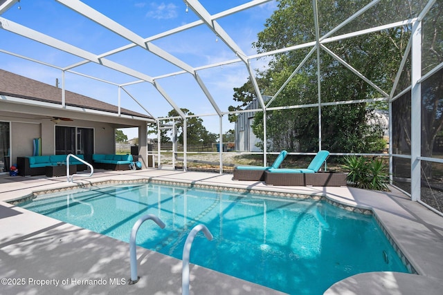 14031 Hexam Rd, Brooksville, FL 34613 - outdoor pool featuring outdoor lounge area, a patio, ceiling fan, and a lanai