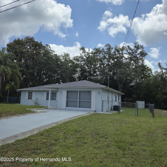 2226 Giralda Ave, Spring Hill, FL 34606 - ranch-style house featuring stucco siding, central AC unit, and a gate