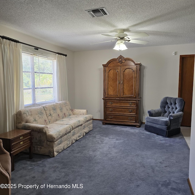 2226 Giralda Ave, Spring Hill, FL 34606 - carpeted living room featuring ceiling fan and a textured ceiling
