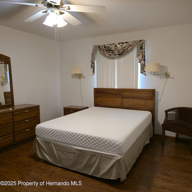 2226 Giralda Ave, Spring Hill, FL 34606 - bedroom with dark wood-type flooring and a ceiling fan