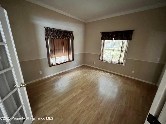 24 Black Willow Ct N, Homosassa, FL 34446 - spare room featuring wood finished floors, ornamental molding, and baseboards
