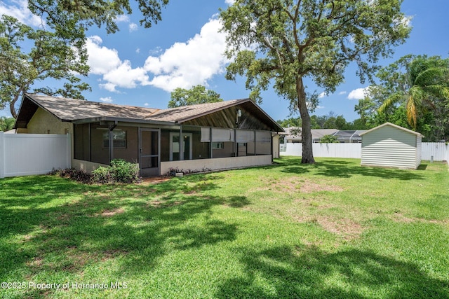 7630 Landmark Dr, Spring Hill, FL 34606 - rear view of house featuring a sunroom